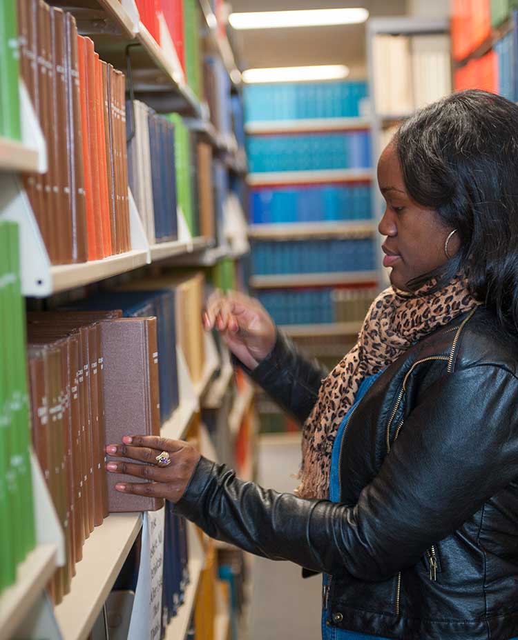 Students Looking through book