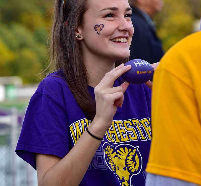 Student in Rams Up gear.