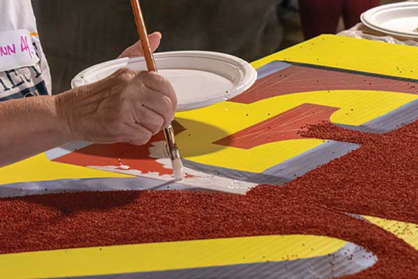 close up image of hand painting sign