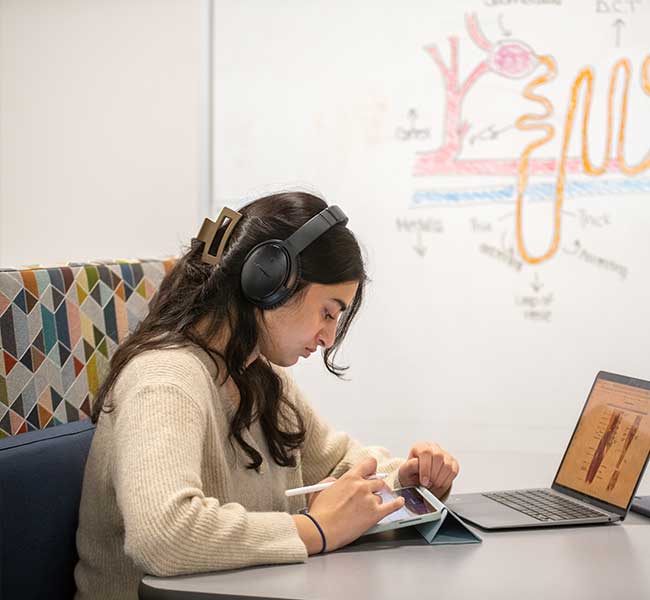 WCU Student working in library