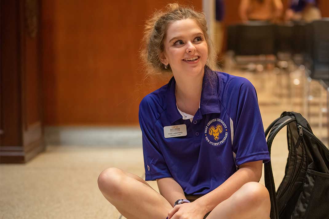 
 Orientation leader sitting on floor 
