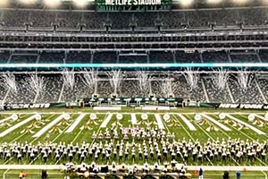 image from above of marching band on a football field