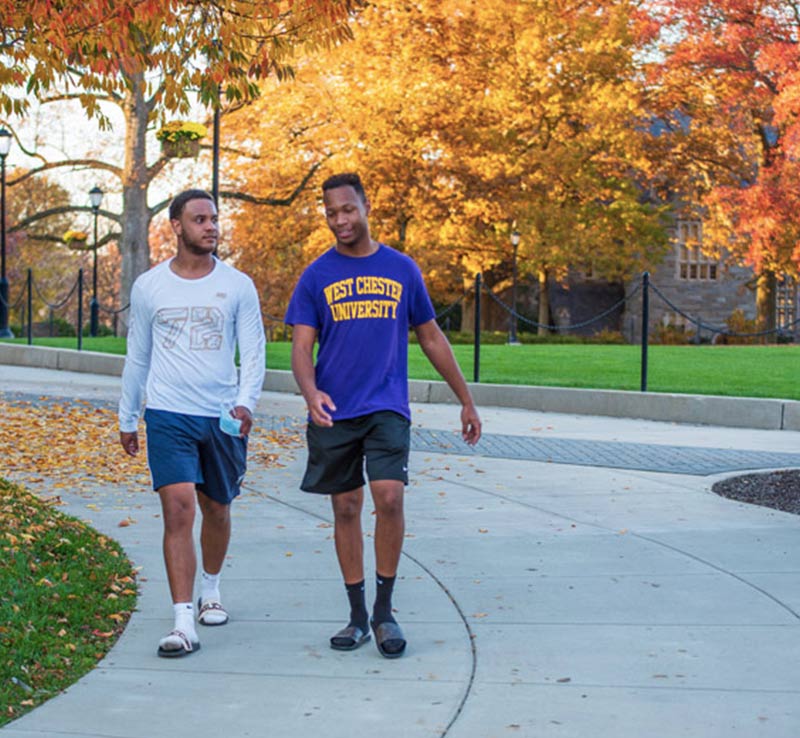 Student in Rams Up gear.